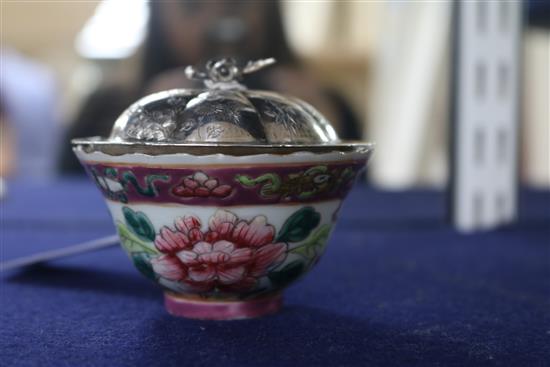 A Chinese silver dish and a porcelain bowl.